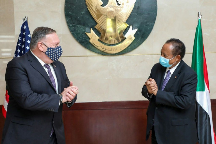 US Secretary of State Mike Pompeo, on a rare visit to Sudan in August 2020, greets Sudanese Prime Minister Abdalla Hamdok amid talks on removing Khartoum as a state sponsor of terrorism