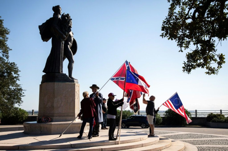 A small group waves Confederate battle flags every weekend in Charleston, South Carolina, a reminder -- even in the run up to a divisive US presidential election on November 3, 2020 -- of the era when slavery tore the nation apart