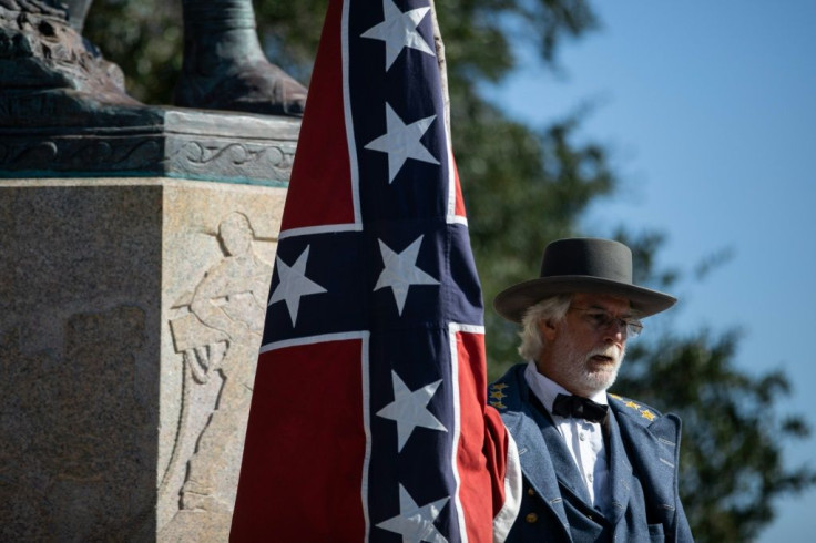 Braxton Spivey describes himself as a "living historian" who supports display of the Confederate battle flag as a way to honor souther Civil War soldiers, but critics call him racist
