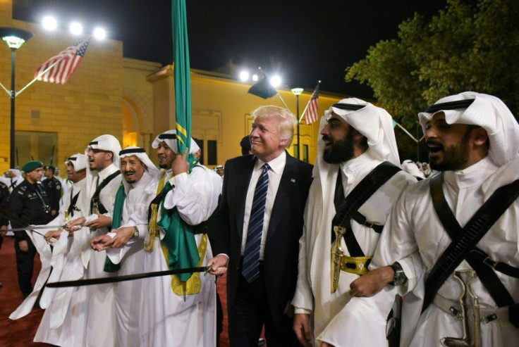 US President Donald Trump joins Saudi Arabia's King Salman bin Abdulaziz al-Saud at a ceremonial sword dance at the Murabba Palace in Riyadh in May 2017