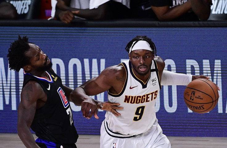 Jerami Grant #9 of the Denver Nuggets drives the ball against Patrick Beverley #21 of the LA Clippers