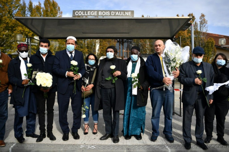 Muslim leaders gathered ouside Paty's school to offer condolences and distance their religion from the atrocity