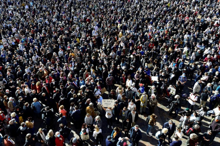 Tens of thousands rallied across France on Sunday in solidarity with the murdered teacher