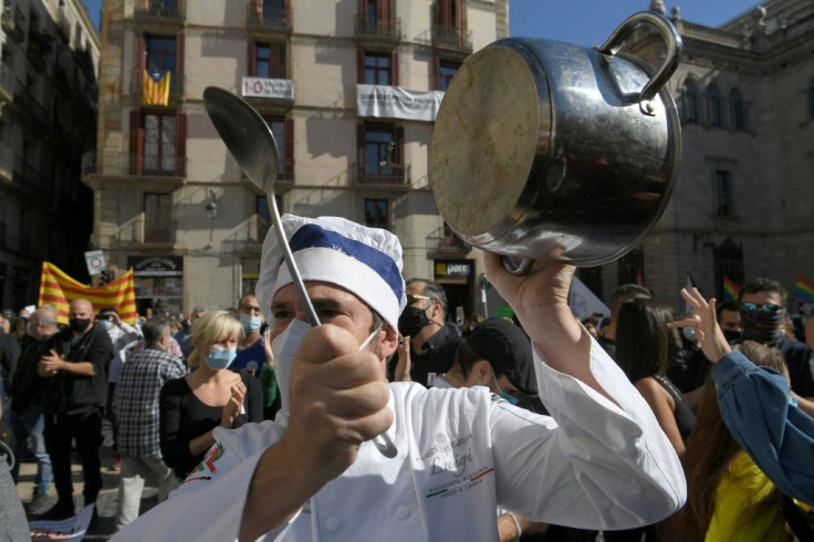 Hundreds of restaurant operators protested Friday in Barcelona against a 15-day shutdown