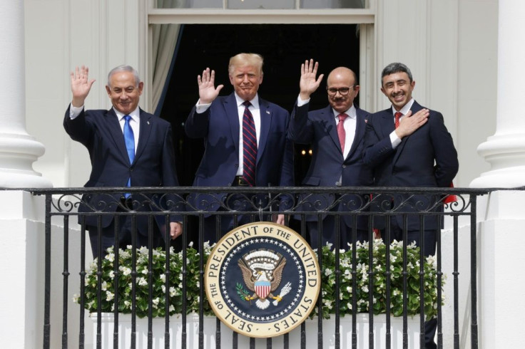 US President Donald Trump is flanked by Israeli Prime Minister Benjamin Netanyahu and the foreign ministers of Bahrain and the United Arab Emirates as they sign a landmark normalization accord on September 15, 2020