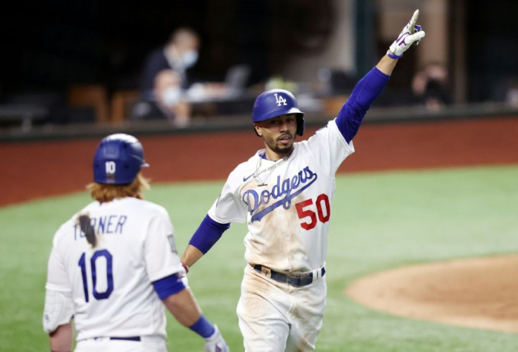 Mookie Betts celebrates after hitting a solo home run for the Los Angeles Dodgers during the team's World Series victory over the Tampa Bay Rays ing game one