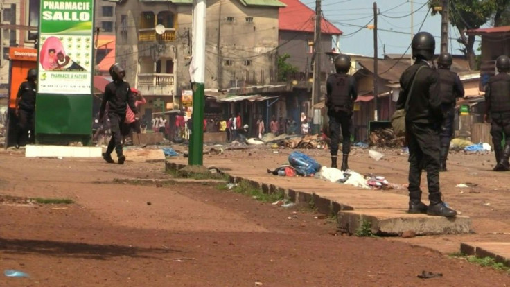 Guinean police and protesters face off in the opposition suburb of Bambeto in the capital Conakry, after the opponents of President Alpha Conde cried fraud in last Sunday's vote, despite African monitors backing the process.