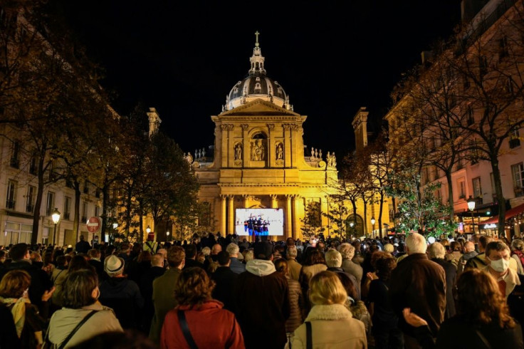 Hundreds gathered outside the Sorbonne University to watch the ceremony commemorating the murdered teacher