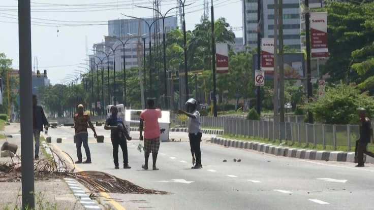 A witness reacts after the shooting of peaceful protesters by security forces that caused international outrage. According to Amnesty International, at least 12 people were killed by the Nigerian army and police in two locations in Lagos on Tuesday 20 Oct