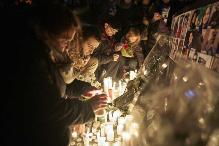 Mourners light candles for the victims of Ukrainian Airlines flight 752 which crashed in Iran during a vigil at Mel Lastman Square in Toronto, Ontario on January 9, 2020