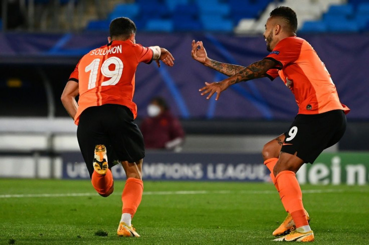 Shakhtar Donetsk's Israeli forward Manor Solomon (L) celebrates with Dentinho after scoring in the Ukrainian side's surprise 3-2 win away to Real Madrid