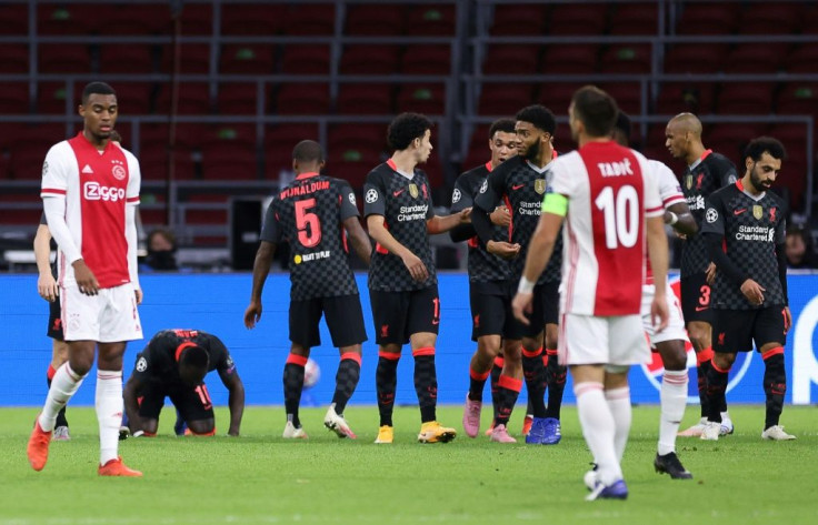 An own goal gave Liverpool a narrow victory away to Ajax in Amsterdam