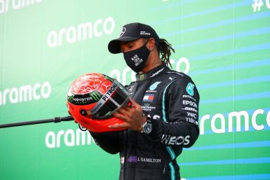 Hamilton, presented with one of Michael Schumacher's helmets at Nurburgring, seeks to claim record outright