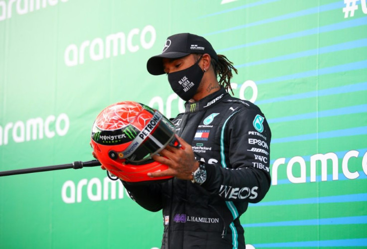 Hamilton, presented with one of Michael Schumacher's helmets at Nurburgring, seeks to claim record outright