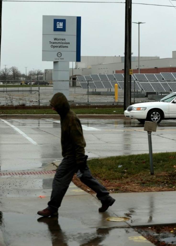 A worker walks in front of GM's plant in Warren, Michigan in November 2018, shortly after the company announced plans to shutter the factory
