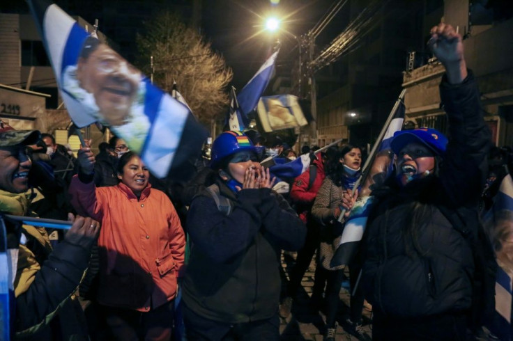 Supporters of Luis Arce of the leftist Movement for Socialism (MAS) party celebrate their candidate's victory in La Paz