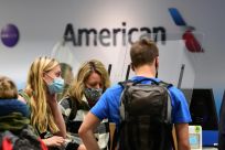 American Airlines says the company's fortunes will hinge largely on the return of business travelers