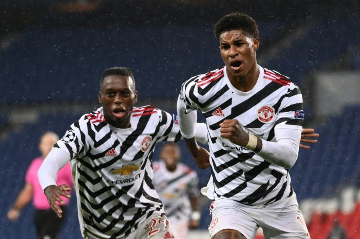Manchester United forward Marcus Rashford (right) celebrates his winning goal against Paris Saint-Germain