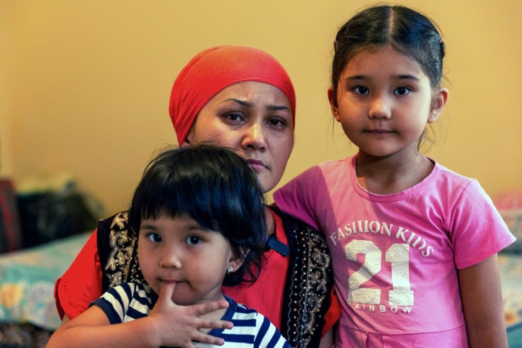 Bikamal Kaken poses with her daughters in Uzynagash