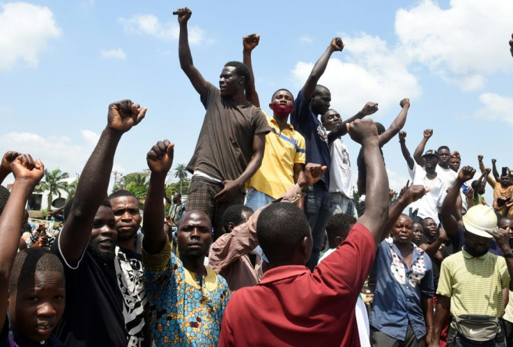 Protesters chant and sing solidarity songs as they barricade the Lagos-Ibadan expressway to protest against police brutality and the killing of protesters by the military, at Magboro, Ogun State