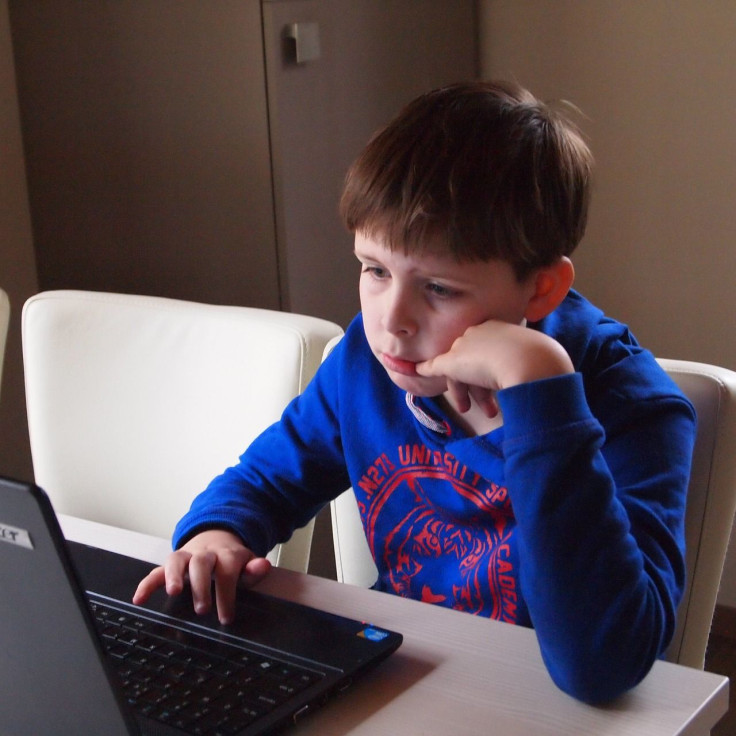 boy attending virtual class