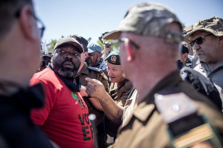 Outside the courthouse during a hearing of the murder suspects groups of whites and blacks faced off