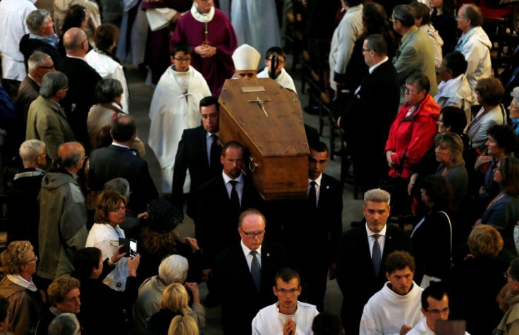 Pallbearers carry the coffin of Jacques Hamel in Rouen's cathedral on August 2, 2016 during the funeral of the priest