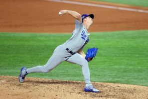 Los Angeles Dodgers ace Walker Buehler delivers a pitch against the Tampa Bay Rays during the fifth inning in game three of the World Series at Globe Life Field in Arlington, Texas