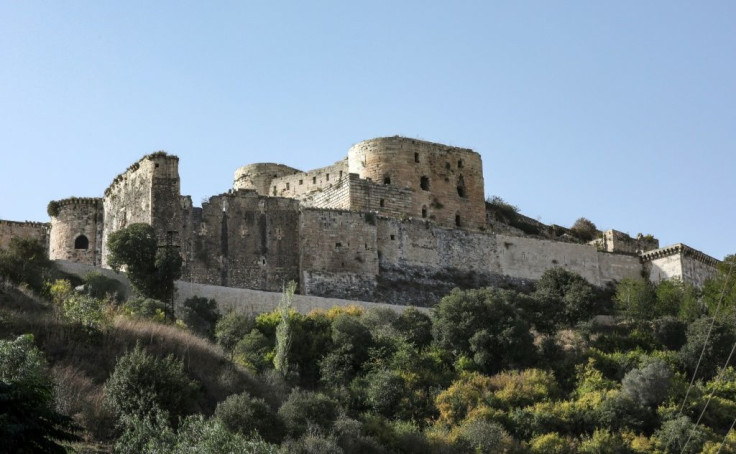 Without the tourists and the money they bring in, the castle's massive ramparts have become overgrown with vegetation that has become a fire tisk in the tinder-dry conditions of late summer