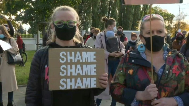 IMAGES Protesters denouncing a near-total ban on abortion gather at the Warsaw headquarters of the governing right-wing Law and Justice (PiS) party.
