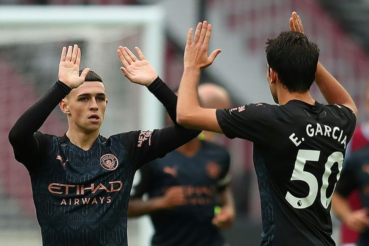 Manchester City midfielder Phil Foden (left) celebrates his equaliser against West Ham