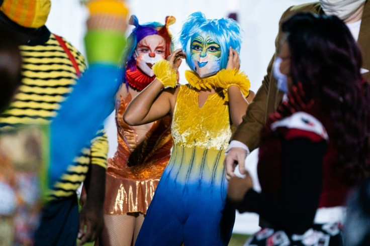 Performers wearing facemasks are seen backstage during The Atlanta Opera's production of "Pagliacci"