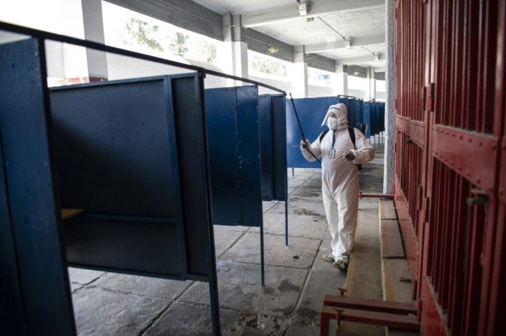Polling stations are being disinfected and will stay open two hours longer than usual to avoid overcrowding due to the coronavirus pandemic which has hit Chile hard