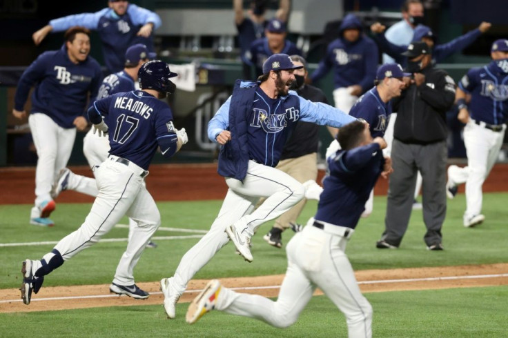 John Curtiss and Tampa Bay Rays teammates celebrate their 8-7 walkoff victory over the Los Angeles Dodgers that leveled the World Series at two games apiece