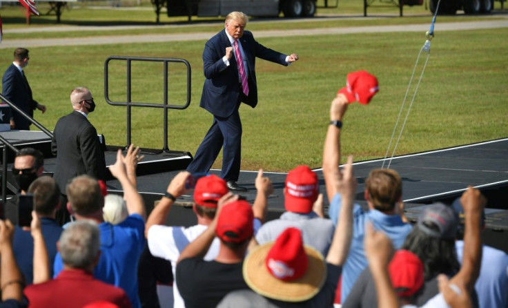 US President Donald Trump dances at the end of a campaign rally in North Carolina on October 24