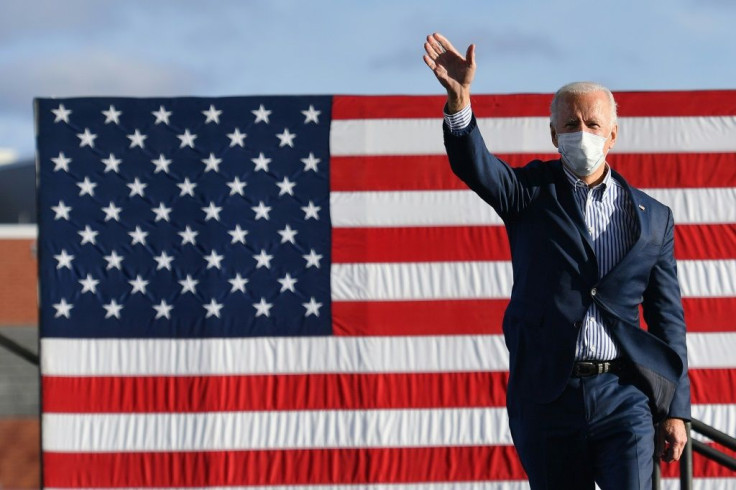 Democratic presidential nominee Joe Biden waves to supporters before speaking at a drive-in rally in Pennsylvania