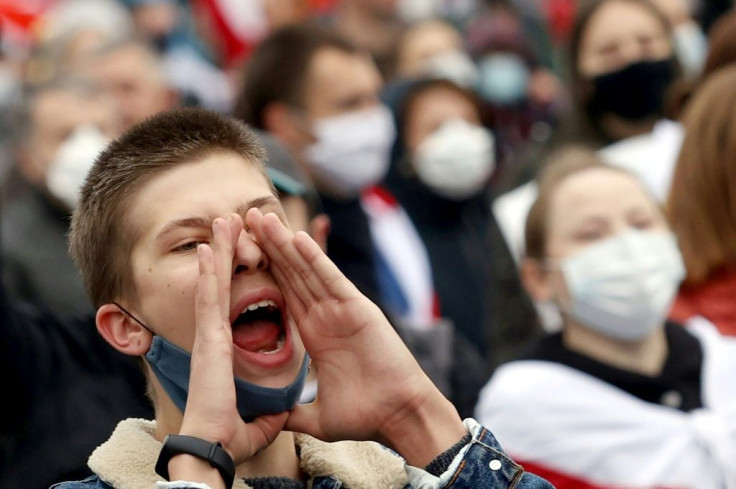 Some protesters on Sunday chanted "strike!" as they marched through the streets