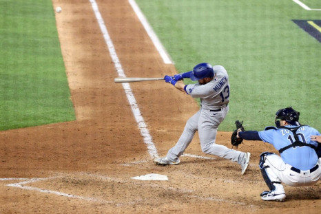 Max Muncy of the Los Angeles Dodgers hits a solo home run in a 4-2 win over the Tampa Bay Rays in game five of baseball's World Series
