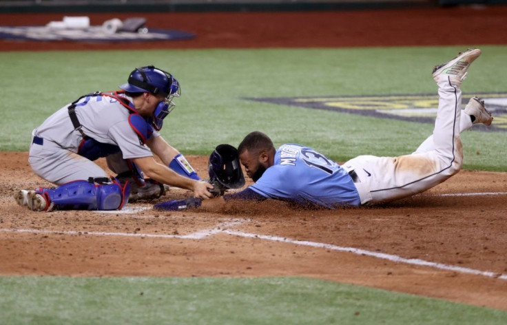 Tampa Bay's Manuel Margot is tagged out by Los Angeles catcher Austin Barnes on an attempt to steal home in the Dodgers' 4-2 win in game five of baseball's World Series