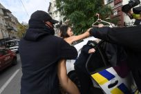 Police officers quickly detained the naked Femen activist