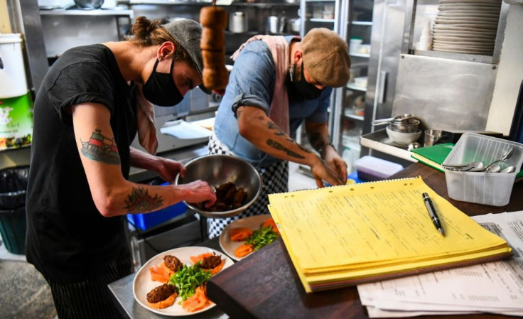 Chefs prepare meals for testing during a staff orientation day as Tiamo Bistro readies for opening in Melbourne after a gruelling lockdown