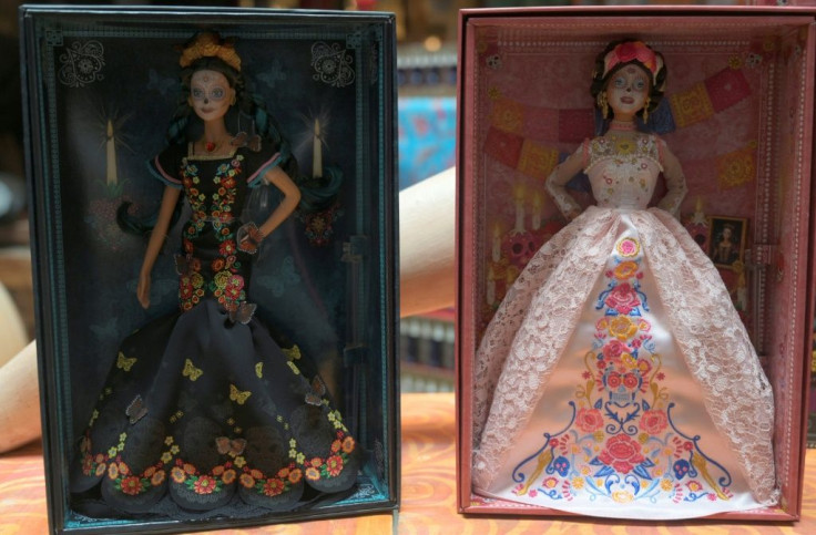 The new Day of the Dead Barbie (R) wears a blush-colored lace dress while the 2019 edition was dressed in black