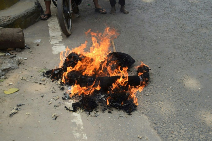 An effigy of French President Emmanuel Macron was burned