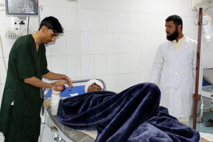 A wounded man receives medical treatment at a hospital after a car bomb attack on an Afghan police base in Khost province