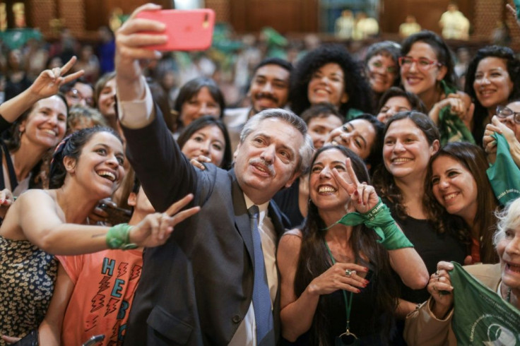 Argentina's President Alberto Fernandez, pictured in November 2019 with pro-choice activists in Buenos Aires