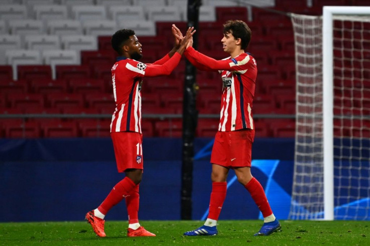 Joao Felix (R) celebrates with Thomas Lemar after scoring twice to help Atletico Madrid to a 3-2 win over Salzburg