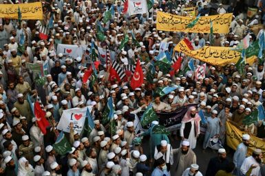 Muslim demonstrators march in Lahore on Wednesday against French President Emmanuel Macron