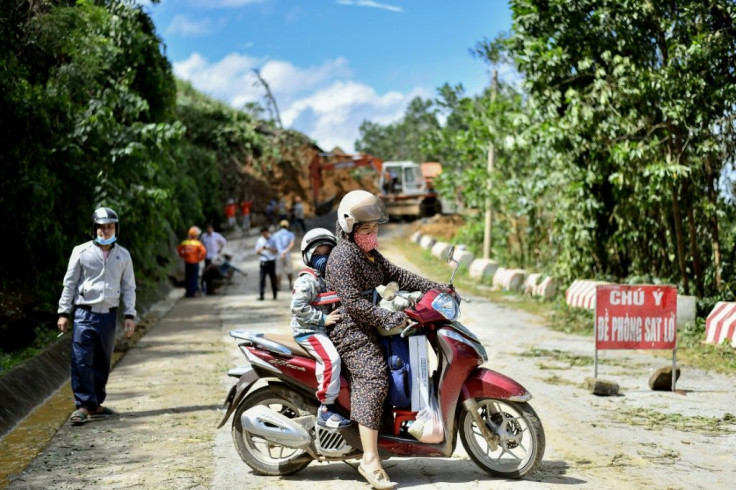 Hundreds of rescuers were desperately trying to reach survivors after several landslides but were blocked by thick mud and fallen trees