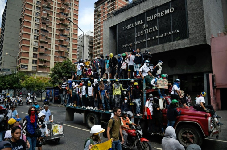 The Supreme Court says journalist and opposition figure Roland Carreno provided logistics for a failed military incursion aimed at toppling President Nicolas Maduro