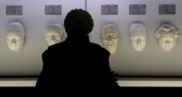A visitor looks on at death masks of Ludwig Van Beethoven (2nd L), Joseph Hayden (C), Wolfgang Amadeus Mozart (2nd R) and Franz Schubert at the Funeral Museum in Vienna